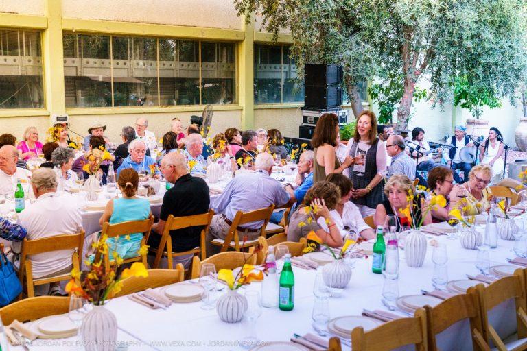 A group of travelers eating at a restaurant in Israel.